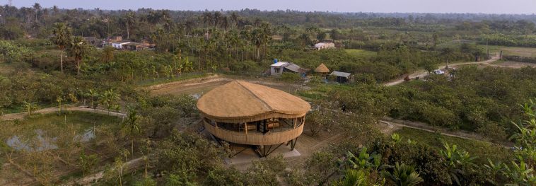 Bamboo home in India overlooks an impressive farm
